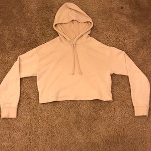 H&M’s Divided pastel pink crop top hoodie.